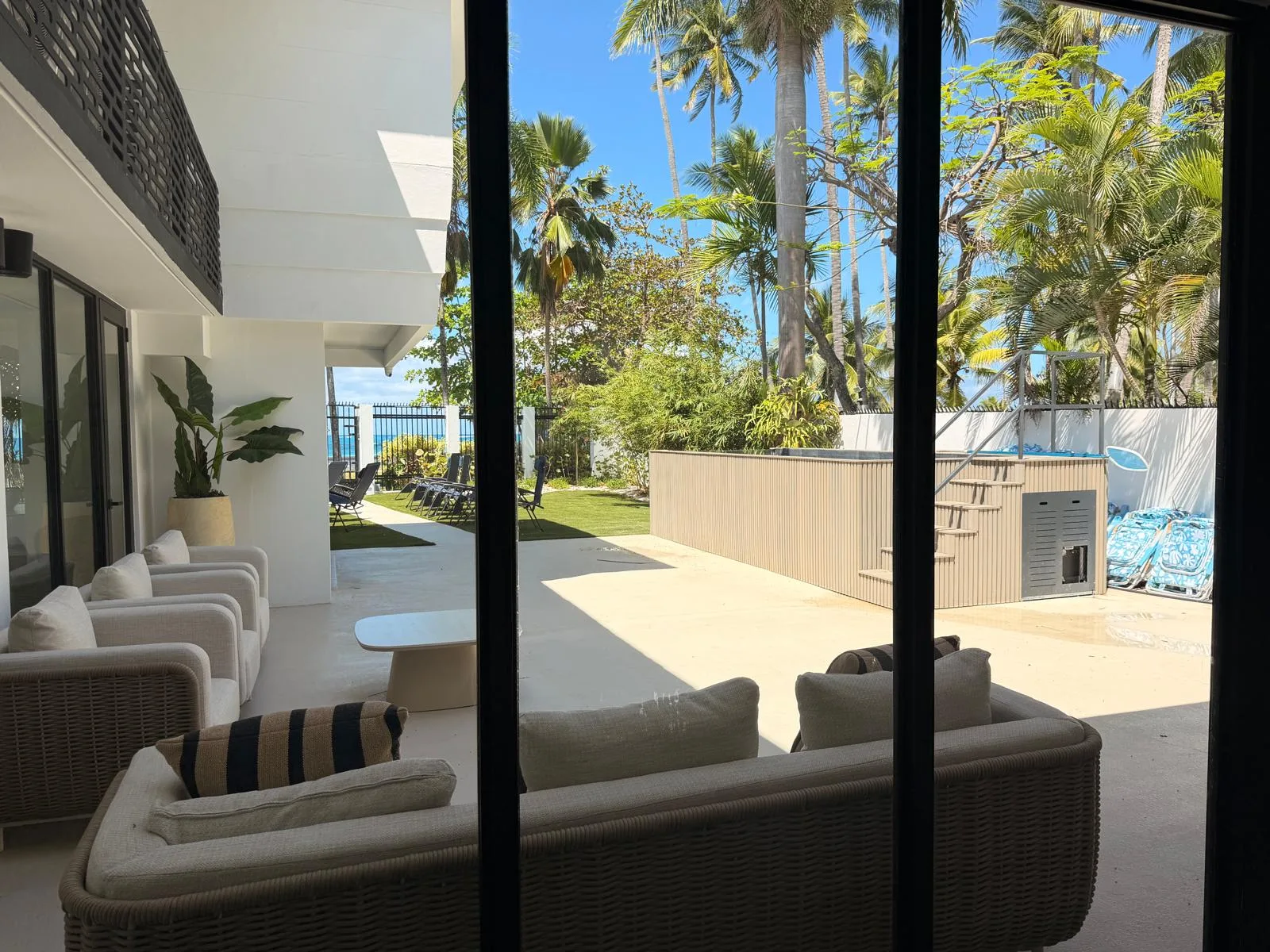 The pool, the palms and the sea beyond