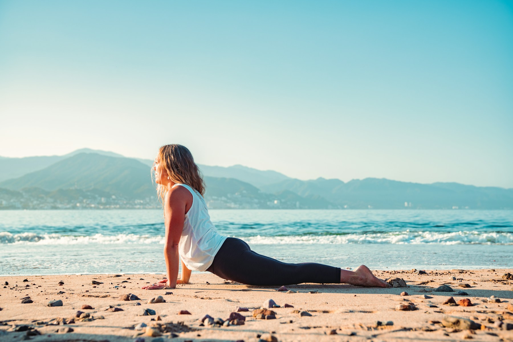 Yoga practice at the shoreline